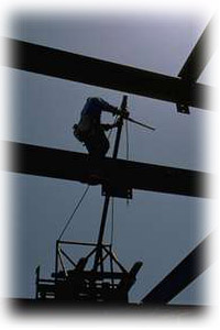 Engineer constructing framework of building
